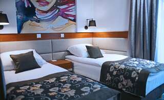 Отель Hotel Kozak Хелм Улучшенный двухместный номер с 2 отдельными кроватями-4